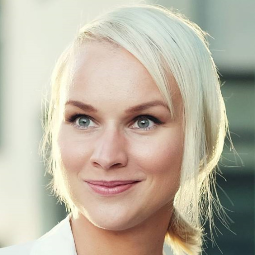 young blond woman walking on the street