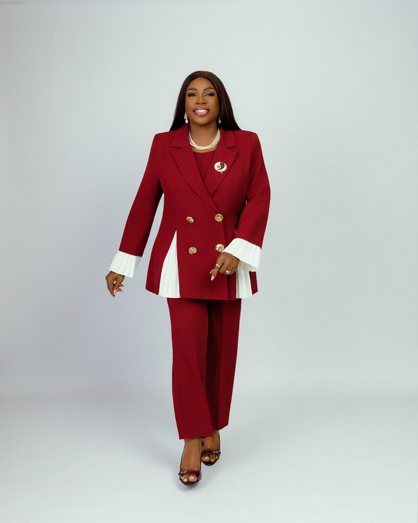 Dr. Janet Adetu in a burgundy trouser suit