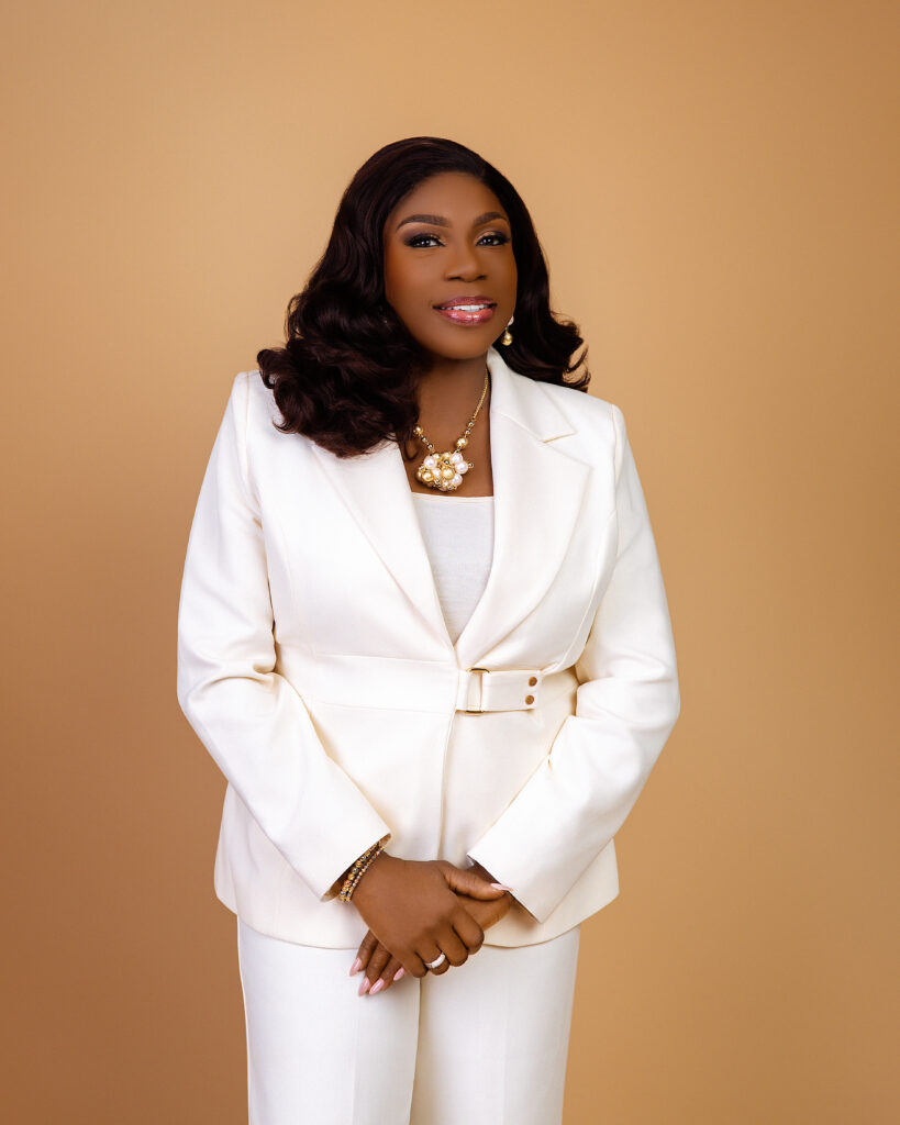 Dr. Janet Adetu in a white suit